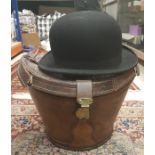 A bowler hat by Moores & Sons Ltd of London in leather hat box