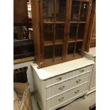 A modern white painted chest of three drawers,