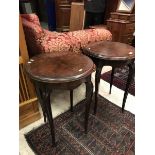 A pair of early 20th Century rosewood occasional tables of circular form raised on cabriole legs