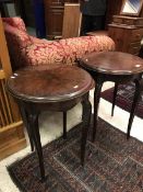 A pair of early 20th Century rosewood occasional tables of circular form raised on cabriole legs