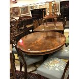 A 19th Century rosewood oval loo table on centre pedestal to quadruped scroll foot base