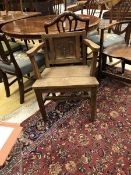 A circa 1900 oak panel seated hall chair,