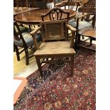 A circa 1900 oak panel seated hall chair,