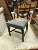 A set of four circa 1900 mahogany shield back dining chairs in the Hepplewhite taste with