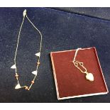 Two 9 carat gold necklaces, one with a heart shaped locket,