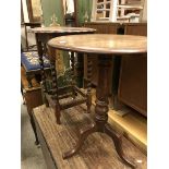 An oak tripod occasional table together with a further oak occasional table and a wrought iron