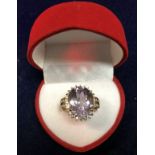 A 9 carat gold pale amethyst set dress ring, approx 5.