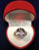 A 9 carat gold pale amethyst set dress ring, approx 5.