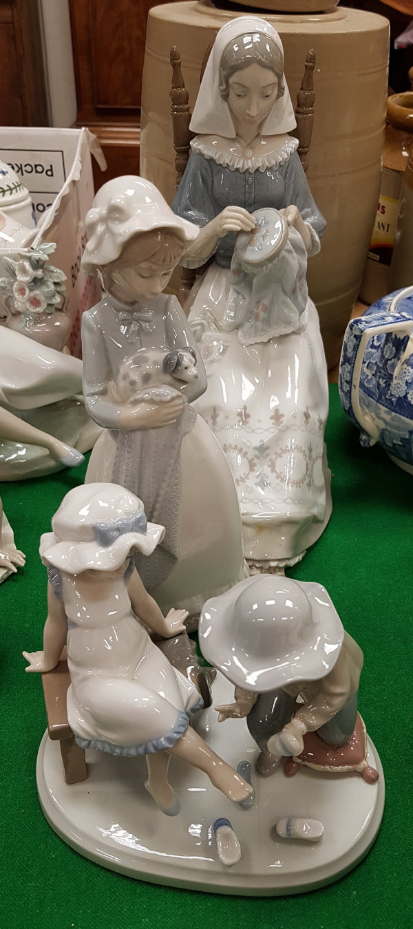 Two Lladro figures including "Woman Seated with Tapestry",