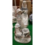 Two Lladro figures including "Woman Seated with Tapestry",