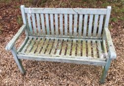 A modern wooden green painted garden bench
