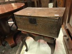 An 18th Century oak bible box the plain top over a lunette carved front panel CONDITION