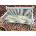 A modern green painted wooden garden bench