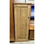 A pine single door cupboard with three shelves