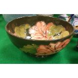 A Moorcroft green ground floral decorated bowl bearing impressed and signed marks to base