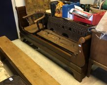 A Continental carved and stained pine bench seat and an elm smokers bow chair