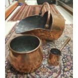 A copper coal scuttle,