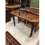 A mahogany side table with raised back and on reeded front legs,