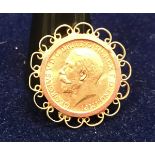 A George V 1912 sovereign in yellow metal mount CONDITION REPORTS This is a full