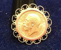 A George V 1912 sovereign in yellow metal mount CONDITION REPORTS This is a full