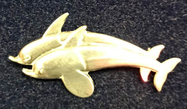 A Georg Jensen silver dolphin brooch, No'd.