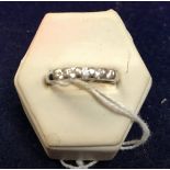 A 9 carat white gold five stone diamond set dress ring, approx 2.