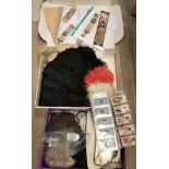 A collection of ostrich modesty fans, embroidered bookmarks, various handbags,
