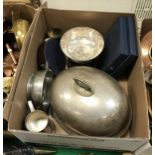 A box containing two plated graduated food domes, a pewter quaich,