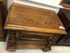 A circa 1900 Continental oak dwarf cupboard with fall-front compartment over a single drawer on