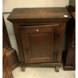 A 19th Century Dutch oak side cabinet the single panel door enclosing a single shelf and three