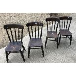 A set of four small stained beech stick back kitchen chairs,