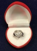 An 18 carat white gold dress ring set with diamonds in loveheart shape, approx 5.