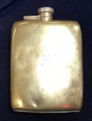 A silver hip flask inscribed "R.C.G.V from E.