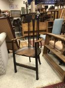 A circa 1900 Arts & Crafts oak chair in the manner of George Walton,