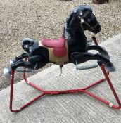 A vintage sprung rocking horse