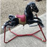 A vintage sprung rocking horse