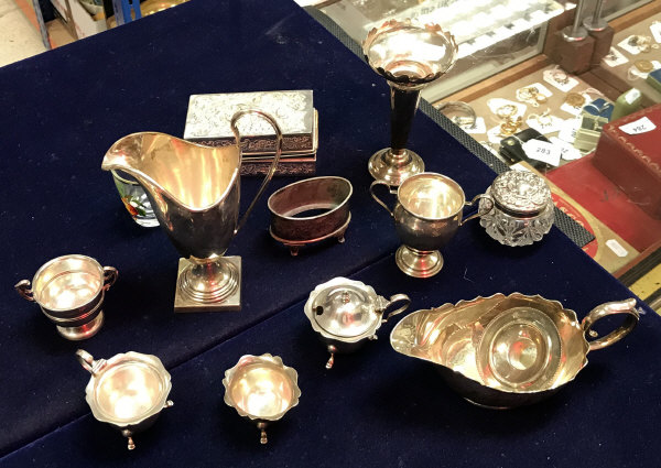 A collection of silver wares to include an inverted helmet cream jug (London 1937),