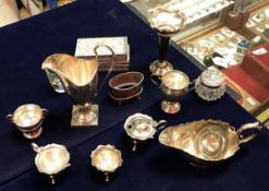 A collection of silver wares to include an inverted helmet cream jug (London 1937),