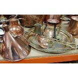 A collection of brass and copper ware to include three cream jugs,