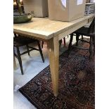 A modern elm plank topped farmhouse style kitchen table