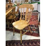 A collection of eight beech slat back kitchen chairs