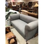 A circa 1900 scroll arm sofa with grey upholstery raised on cabriole legs CONDITION