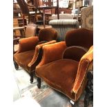 A pair of circa 1900 upholstered scroll arm tub chairs