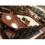 A Victorian mahogany D-end dining table with split centre pedestal pulling apart to allow for