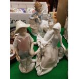 A collection of four Lladro figures including "Young Girl Picking Petals from a Flower",