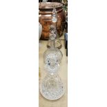 A modern conical shaped decanter with teardrop shaped stopper together with two further cut glass
