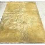 A Chinese superwash rug of plain yellow ground approx.