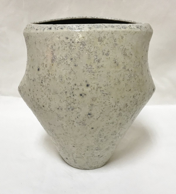 CHRIS CARTER (Born 1945) - a thrown and altered vase with textured glaze of mottled blues on cream