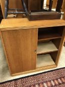 A pair of mid 20th Century oak veneered cabinets with sliding doors CONDITION REPORTS