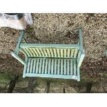 A modern wooden green painted garden bench